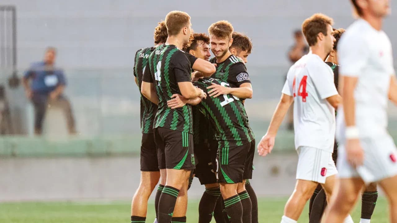 Players celebrating a goal during match Players celebrating a goal during match