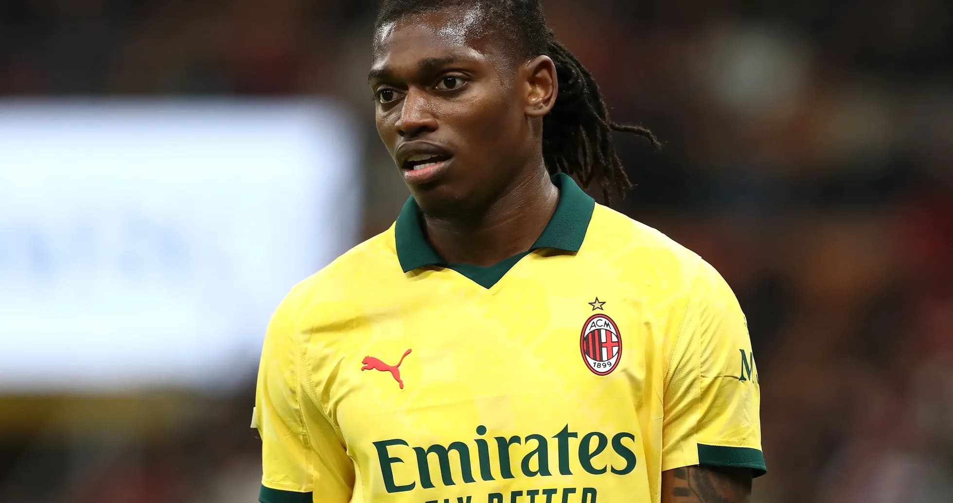 AC Milan player in yellow kit during match AC Milan player in yellow kit during match