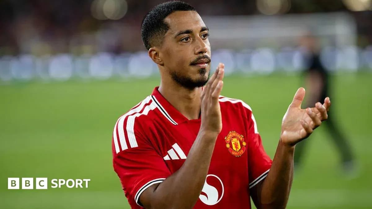 Player applauding fans wearing Manchester United jersey Player applauding fans wearing Manchester United jersey