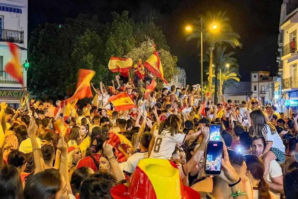 Crowd celebrating with flags in night street Crowd celebrating with flags in night street