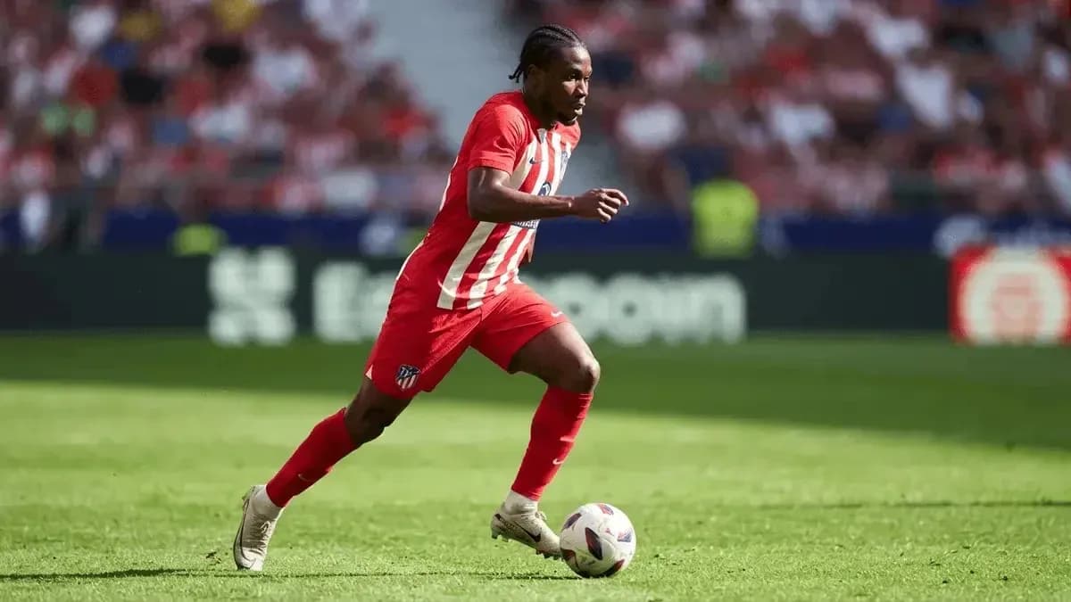 Atletico Madrid player running with the ball Atletico Madrid player running with the ball