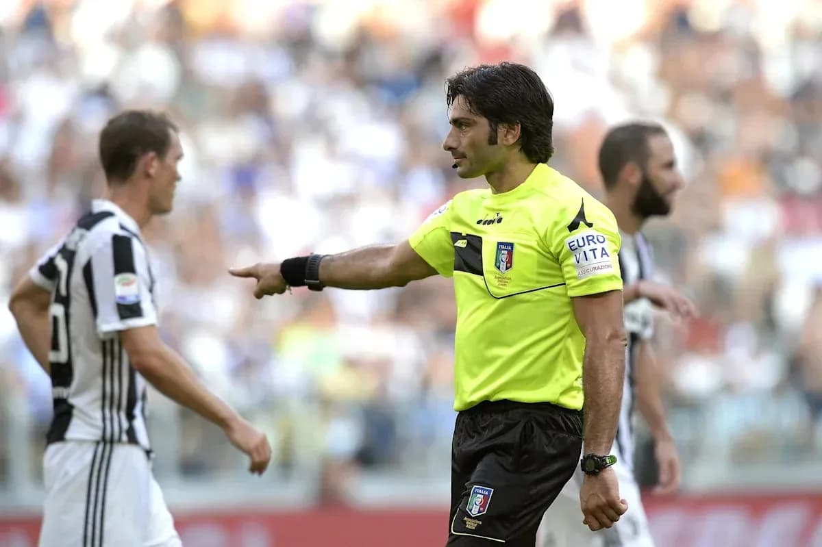 Referee signaling during a football match Referee signaling during a football match