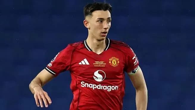 Player in Manchester United kit on the field Player in Manchester United kit on the field