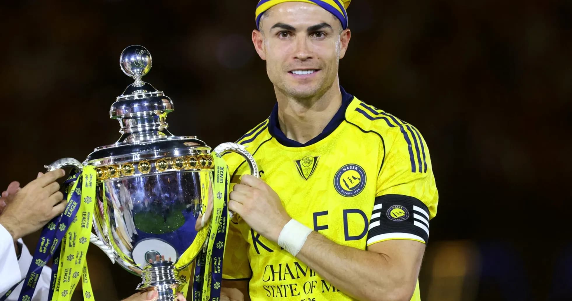 Player holding trophy after winning the match Player holding trophy after winning the match