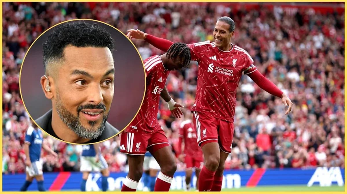 Liverpool players celebrating a goal in stadium Liverpool players celebrating a goal in stadium
