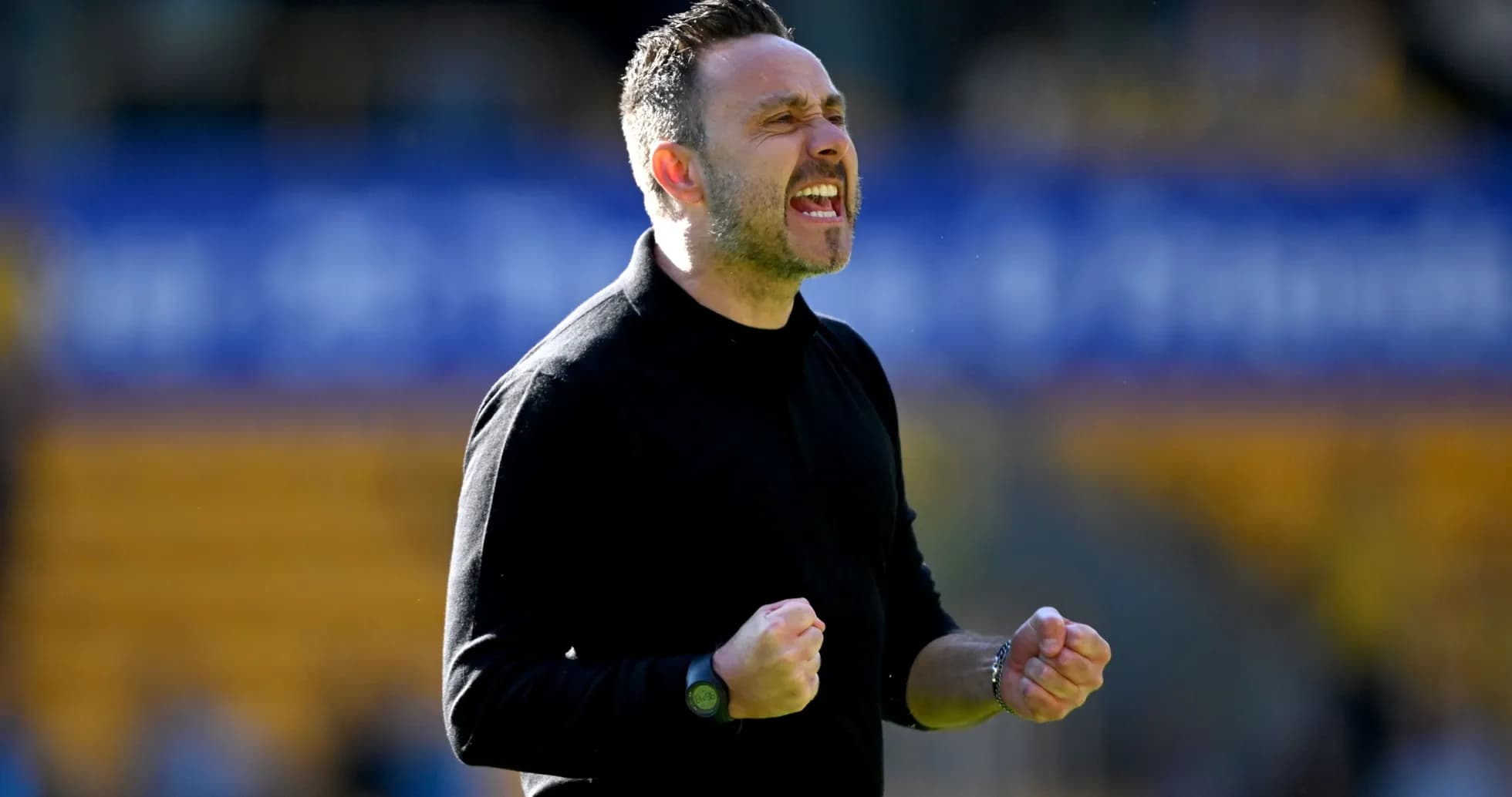 Coach celebrating on the sidelines during match Coach celebrating on the sidelines during match