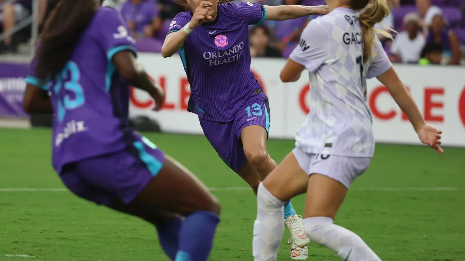 Orlando Pride player in action against Portland Thorns Orlando Pride player in action against Portland Thorns