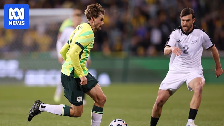 Player dribbling past opponent during soccer match Player dribbling past opponent during soccer match