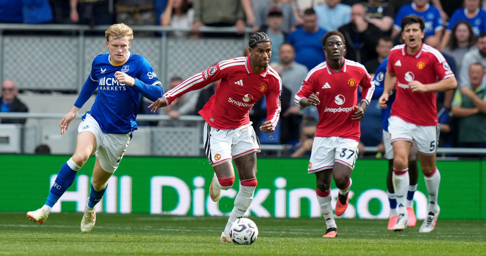 Manchester United players sprinting during match against Everton Manchester United players sprinting during match against Everton