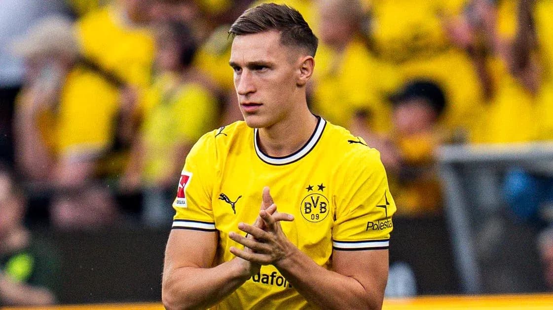 Player in yellow Borussia Dortmund jersey clapping Player in yellow Borussia Dortmund jersey clapping