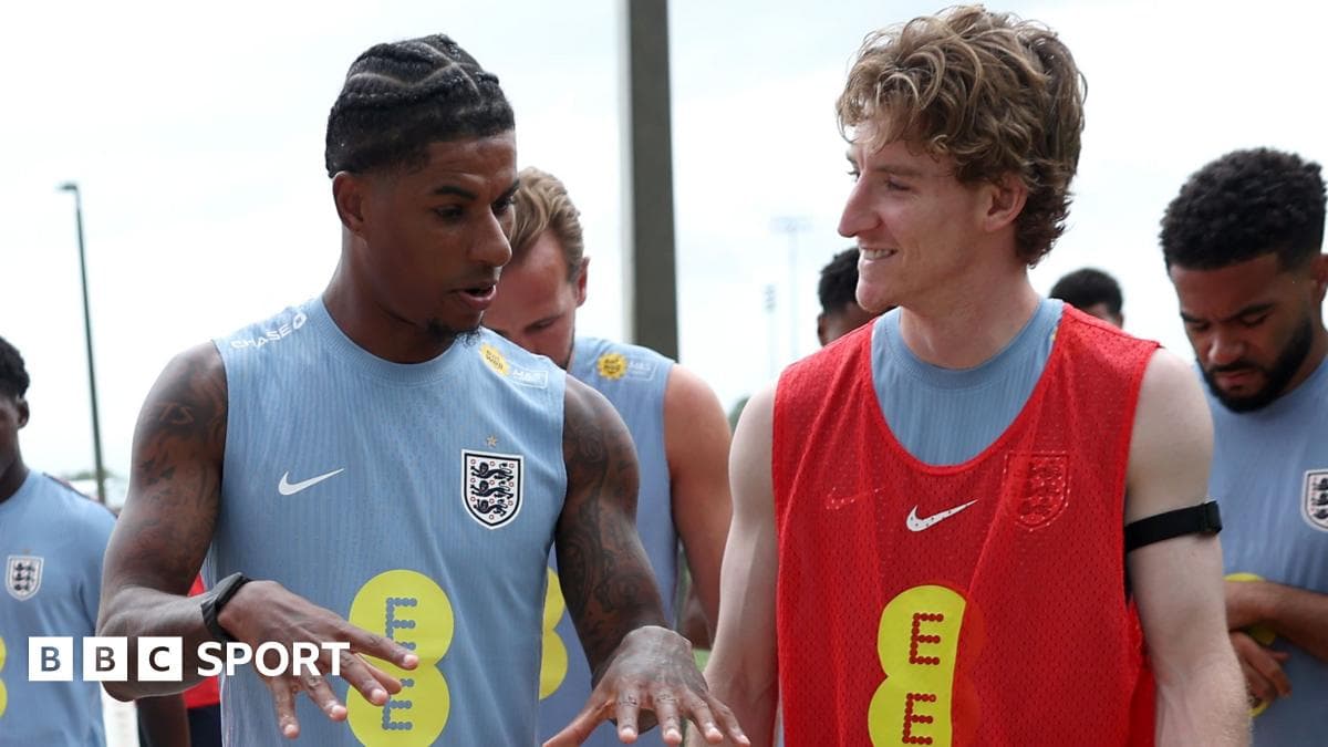 Two players interacting during England training session Two players interacting during England training session