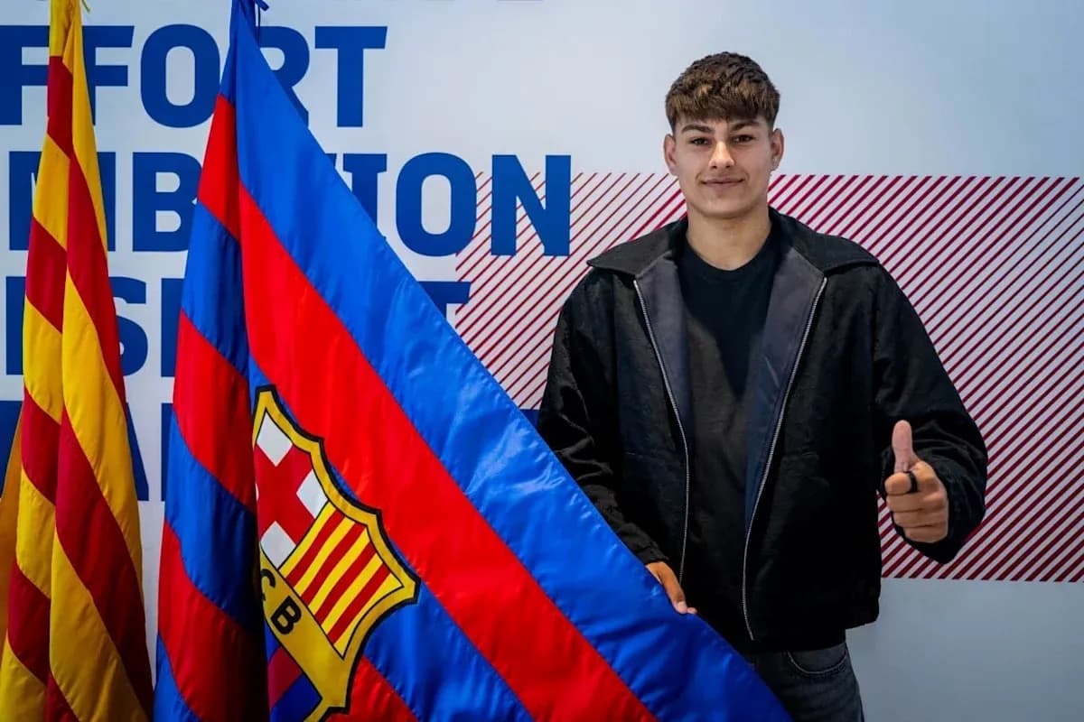 Player posing with FC Barcelona flag and logo Player posing with FC Barcelona flag and logo