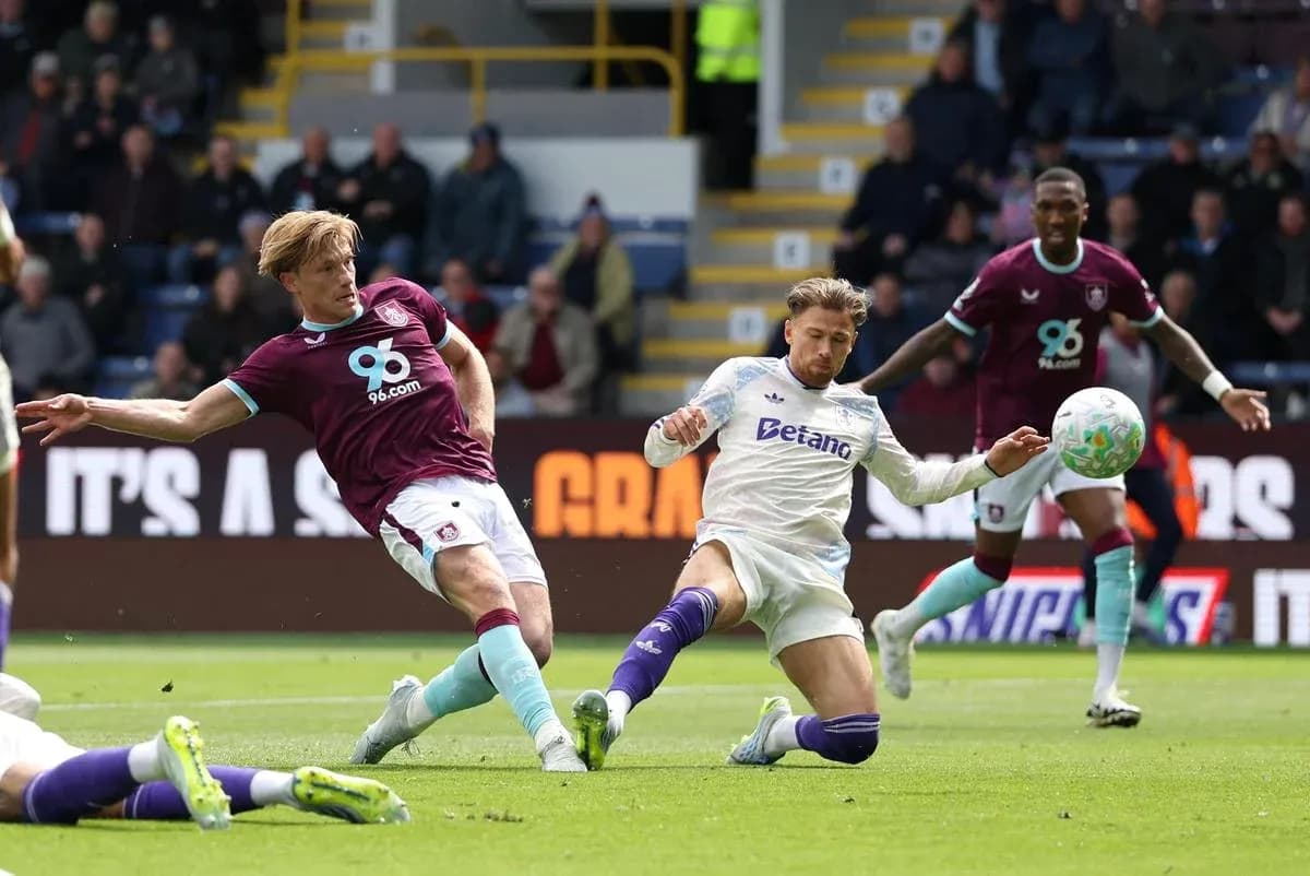 Burnley player tackling Aston Villa opponent Burnley player tackling Aston Villa opponent