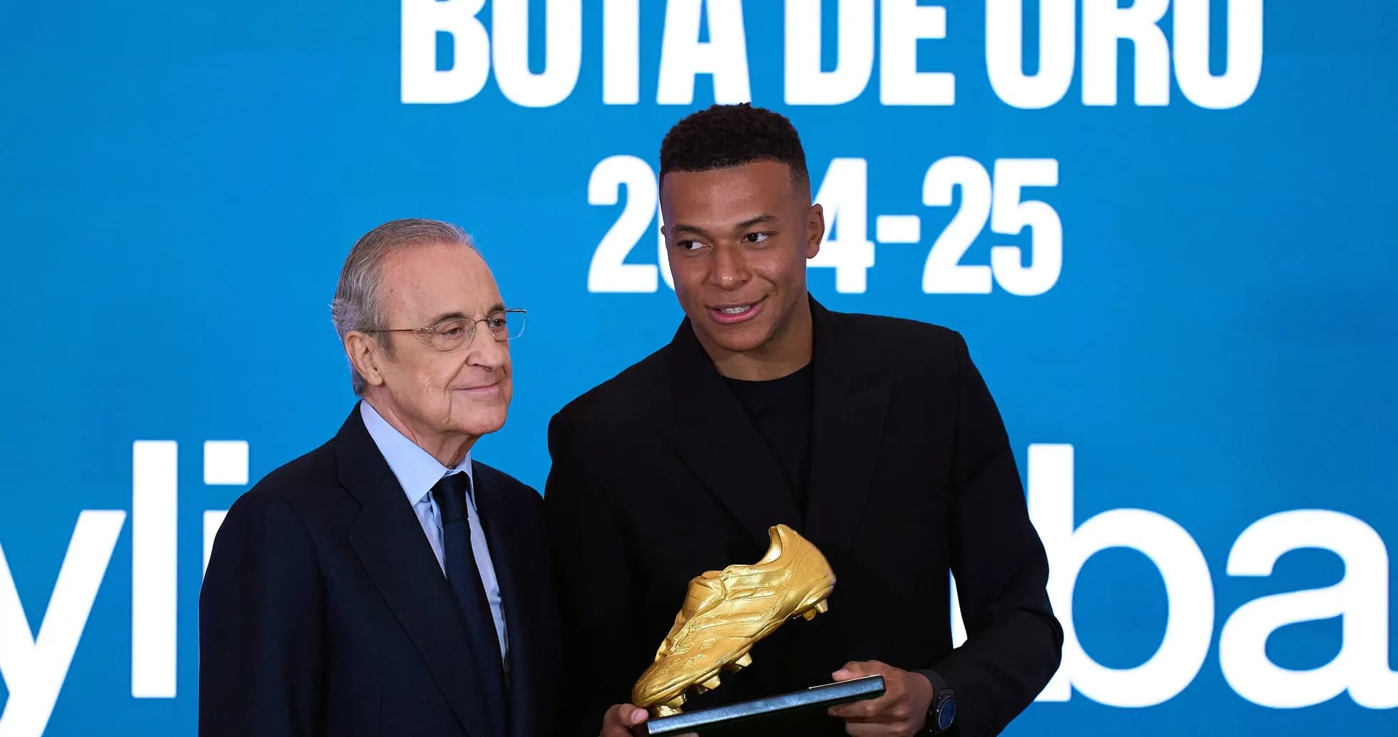 Player receiving Golden Boot award at ceremony Player receiving Golden Boot award at ceremony