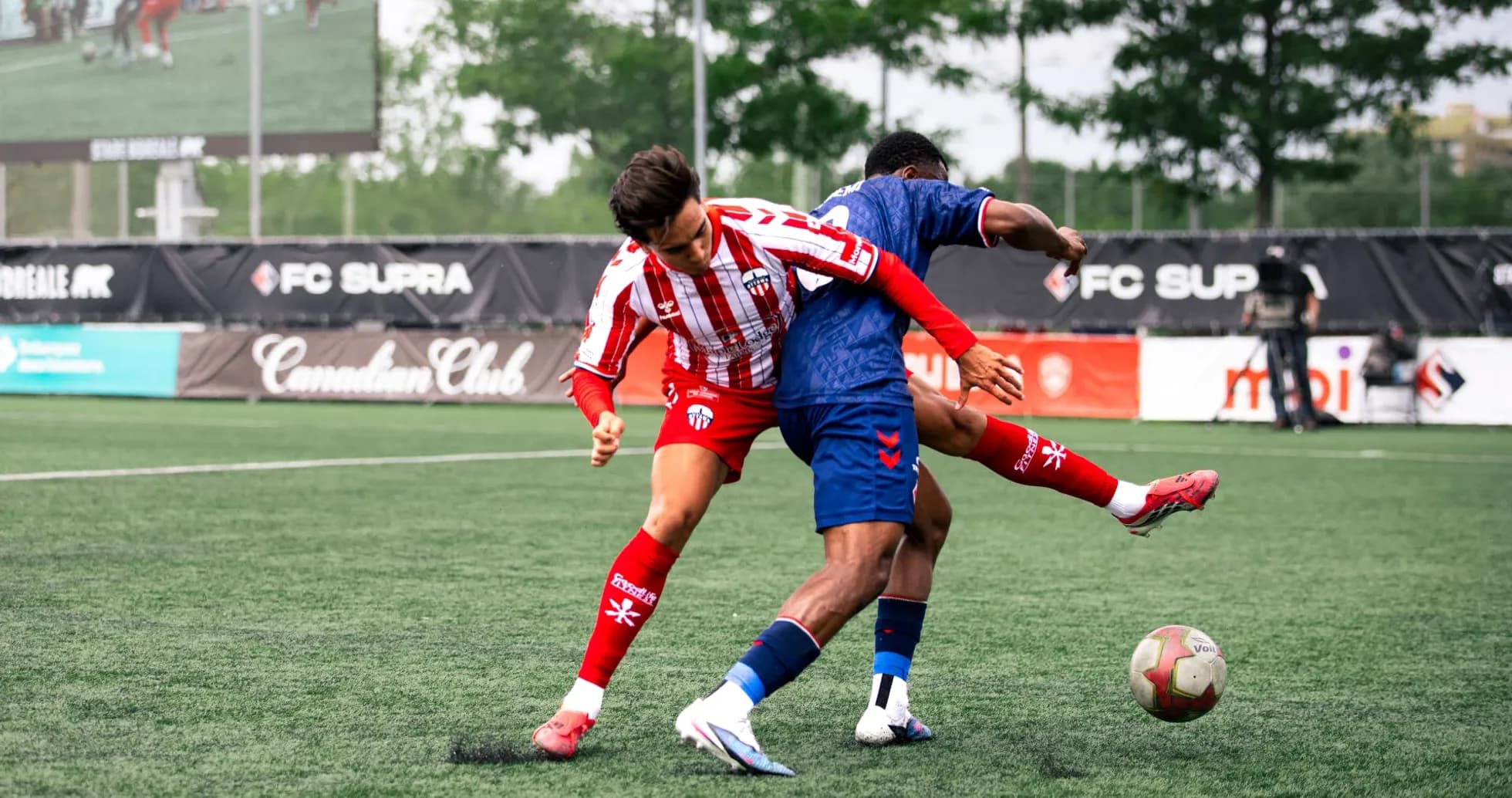 Players competing for the ball in match Players competing for the ball in match