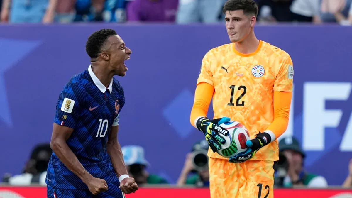 Player celebrating while goalkeeper holds the ball Player celebrating while goalkeeper holds the ball
