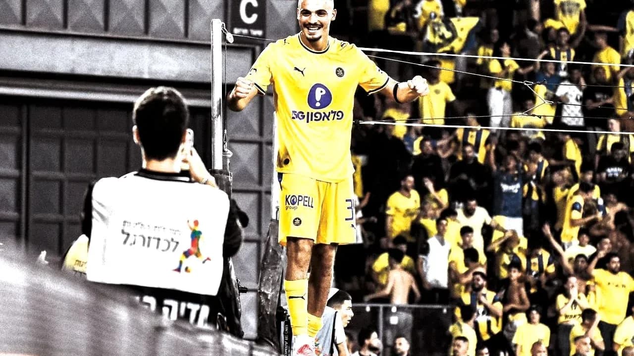 Maccabi Tel Aviv player celebrating with fans Maccabi Tel Aviv player celebrating with fans