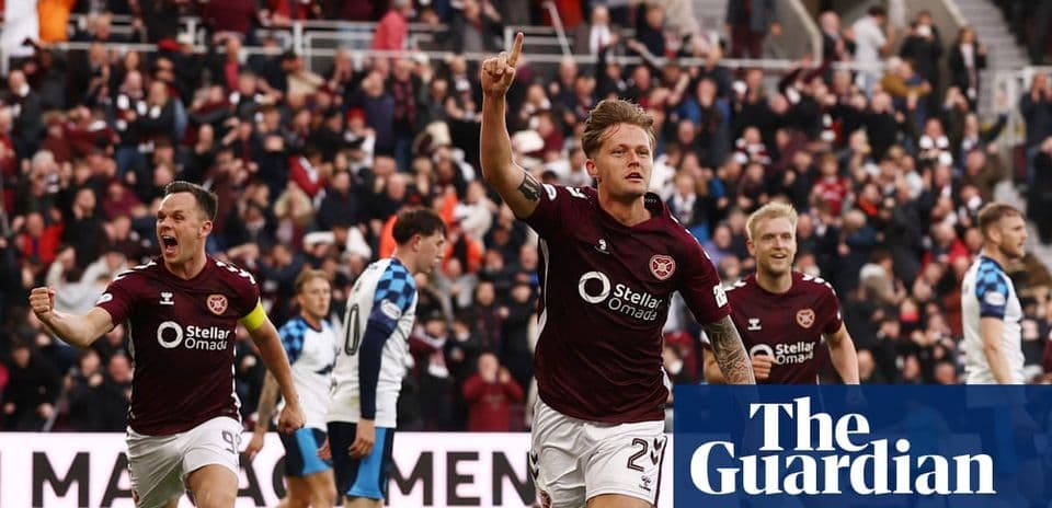 Player celebrating goal with teammates during match Player celebrating goal with teammates during match