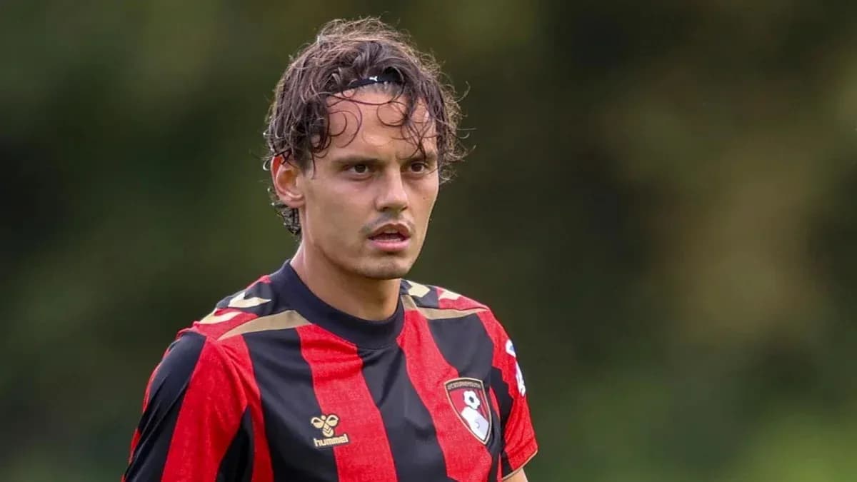 Player in black and red jersey during match Player in black and red jersey during match