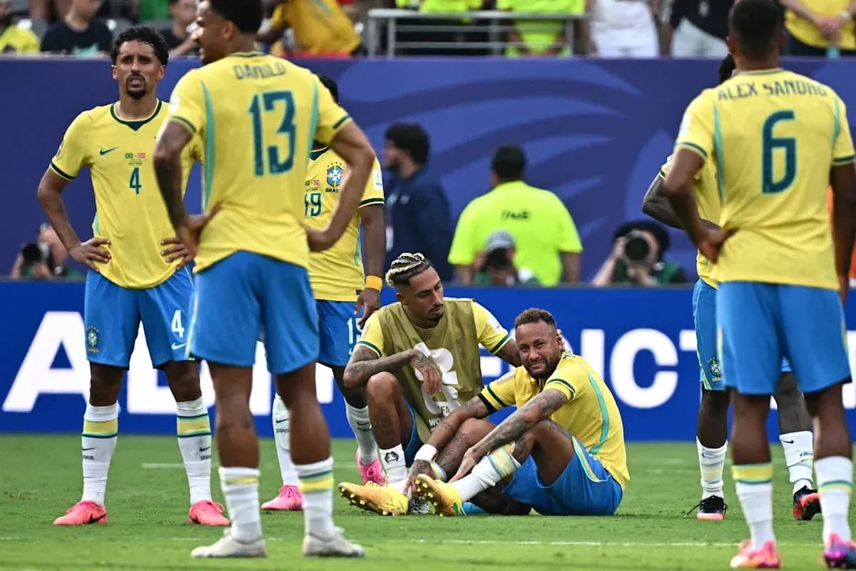 Brazil players surrounding injured teammate on field Brazil players surrounding injured teammate on field