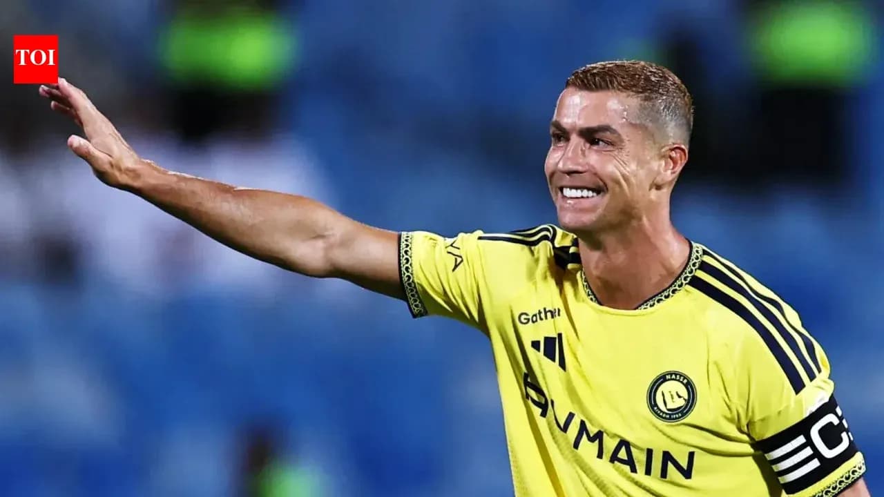 Player waving while wearing yellow team jersey Player waving while wearing yellow team jersey