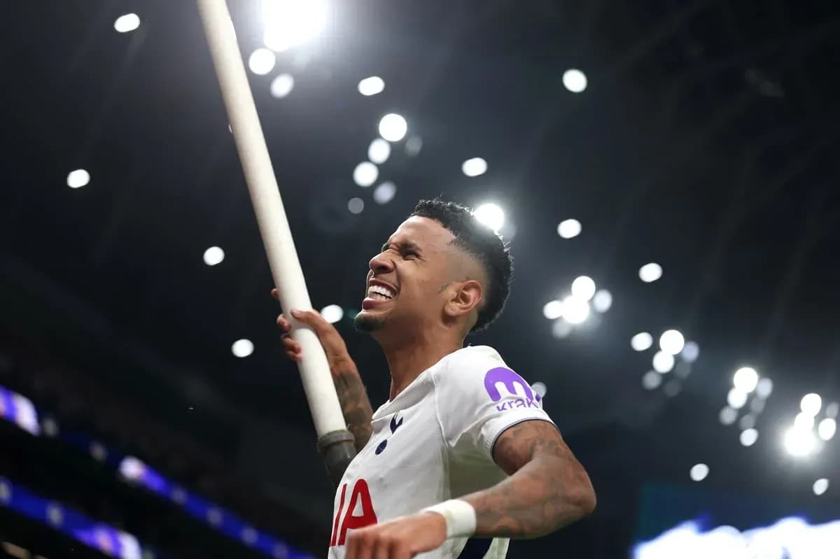 Player celebrating with a flag after scoring Player celebrating with a flag after scoring