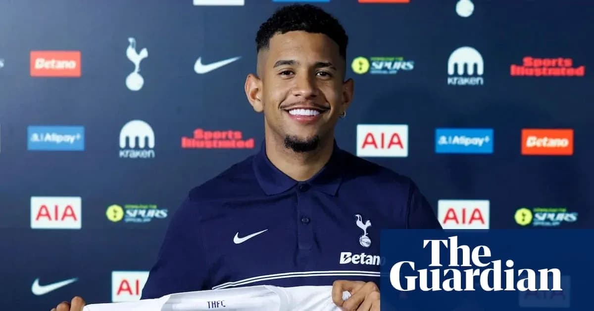 Player holding Tottenham Hotspur jersey at presentation Player holding Tottenham Hotspur jersey at presentation