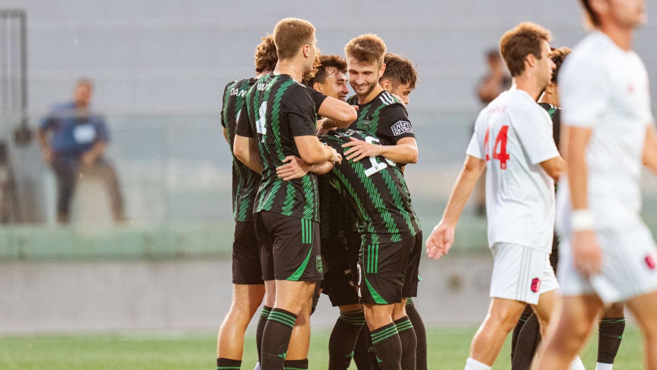 Players celebrating a goal during match Players celebrating a goal during match