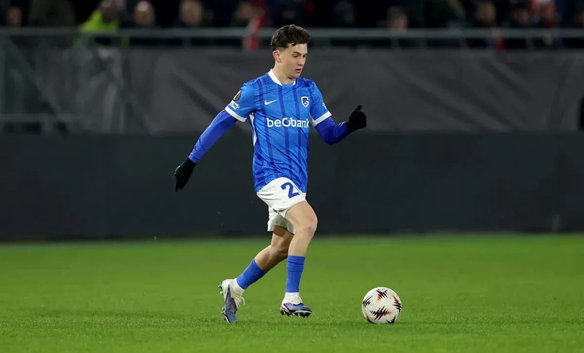 Player in blue kit kicking soccer ball on field Player in blue kit kicking soccer ball on field