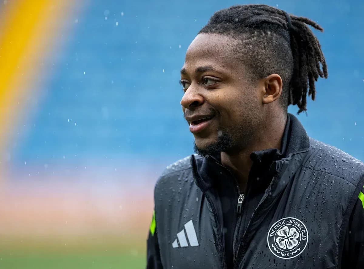 Player smiling during rainy training session outdoors Player smiling during rainy training session outdoors