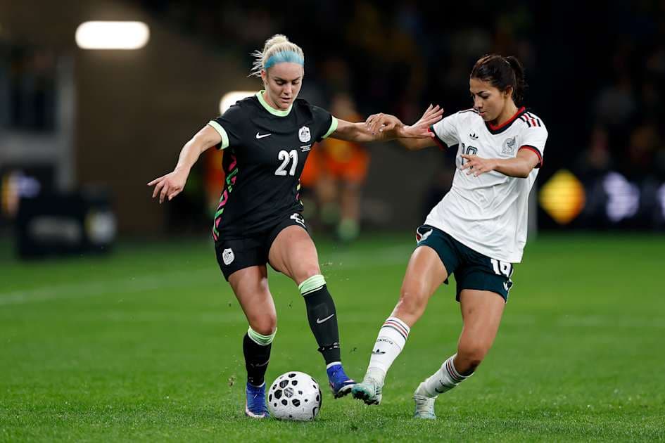 Players competing for the ball during soccer match Players competing for the ball during soccer match