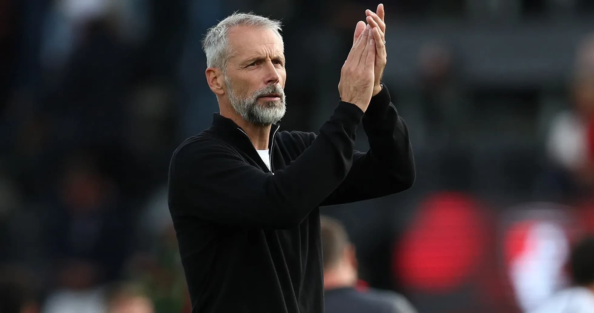 Coach applauding fans during a match Coach applauding fans during a match