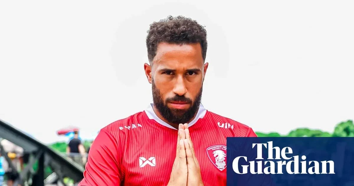 Player in red jersey with hands in prayer position Player in red jersey with hands in prayer position