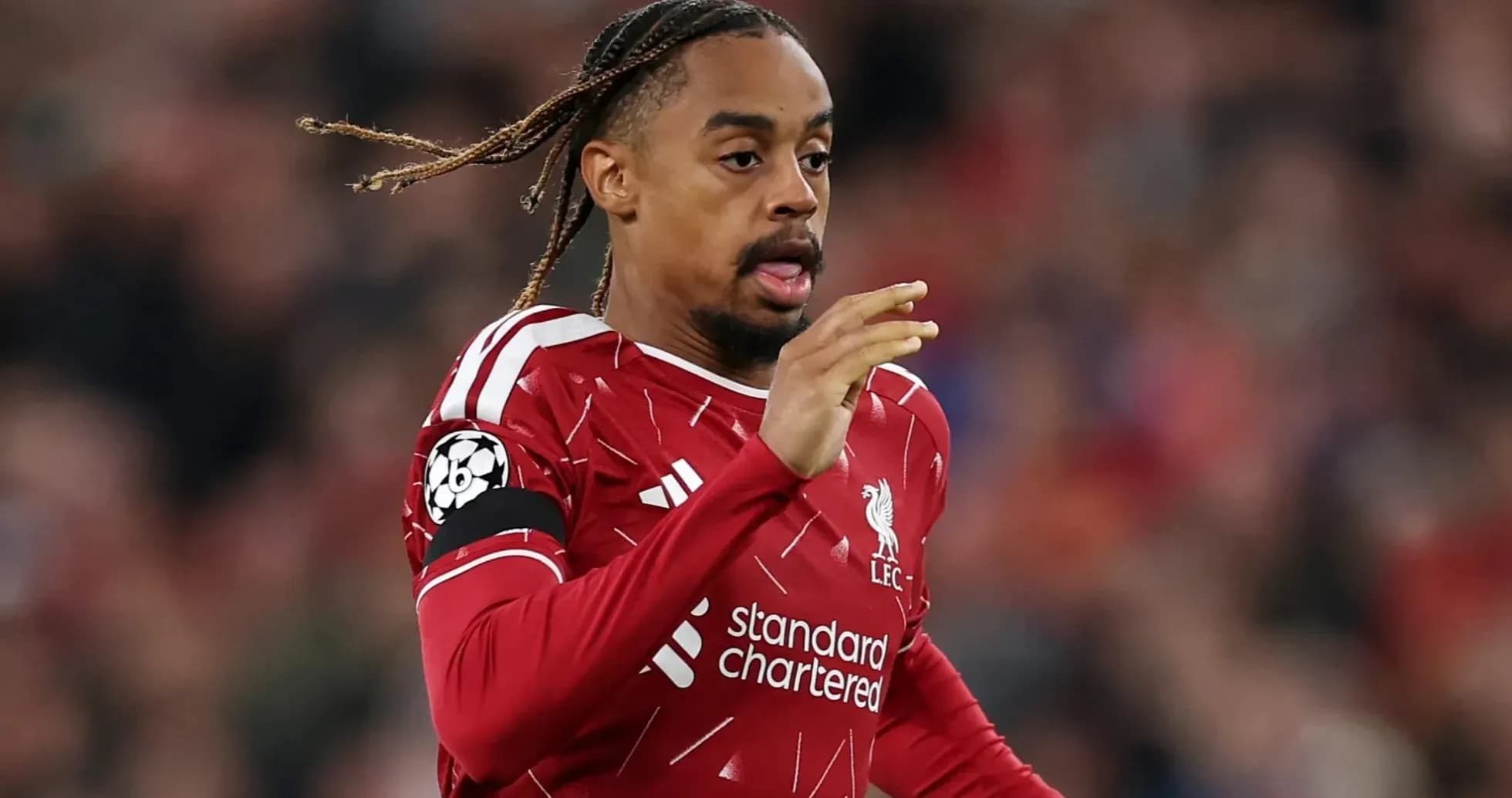 Player running on the pitch in Liverpool kit Player running on the pitch in Liverpool kit