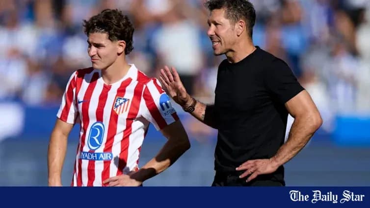 Atletico Madrid player receiving instructions from coach Atletico Madrid player receiving instructions from coach