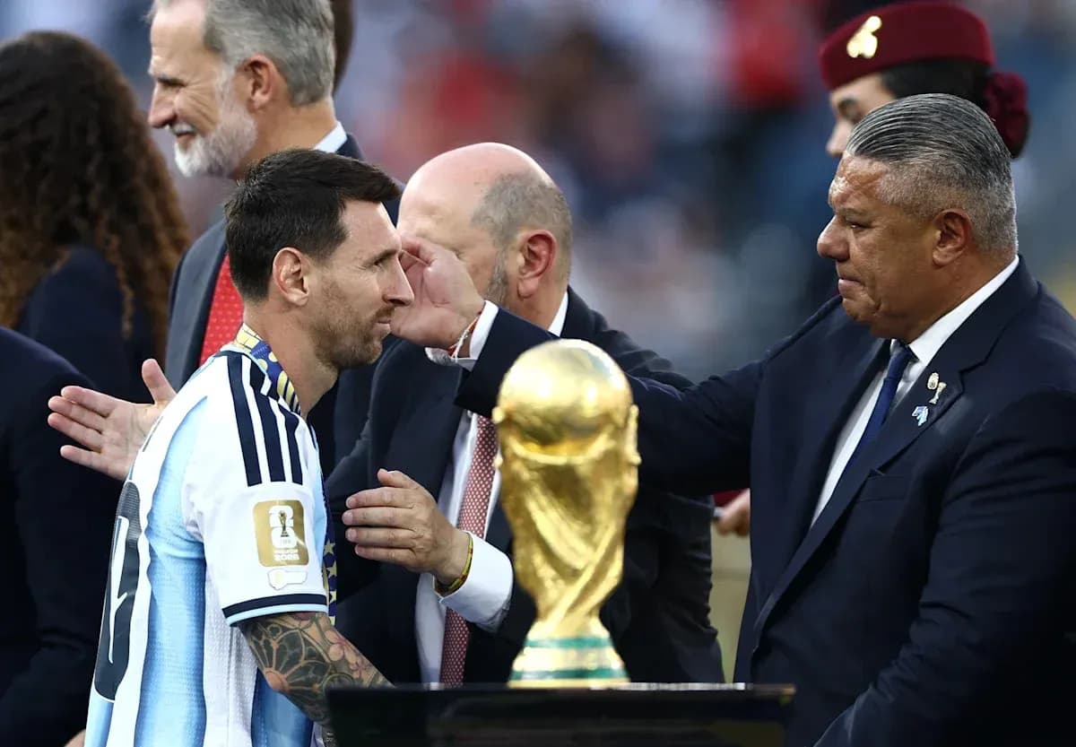Lionel Messi receiving trophy after championship victory Lionel Messi receiving trophy after championship victory