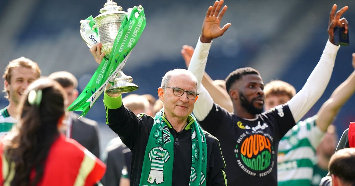 Man holding trophy with celebratory crowd behind Man holding trophy with celebratory crowd behind