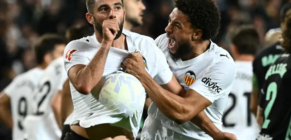 Valencia players celebrating a goal during match Valencia players celebrating a goal during match