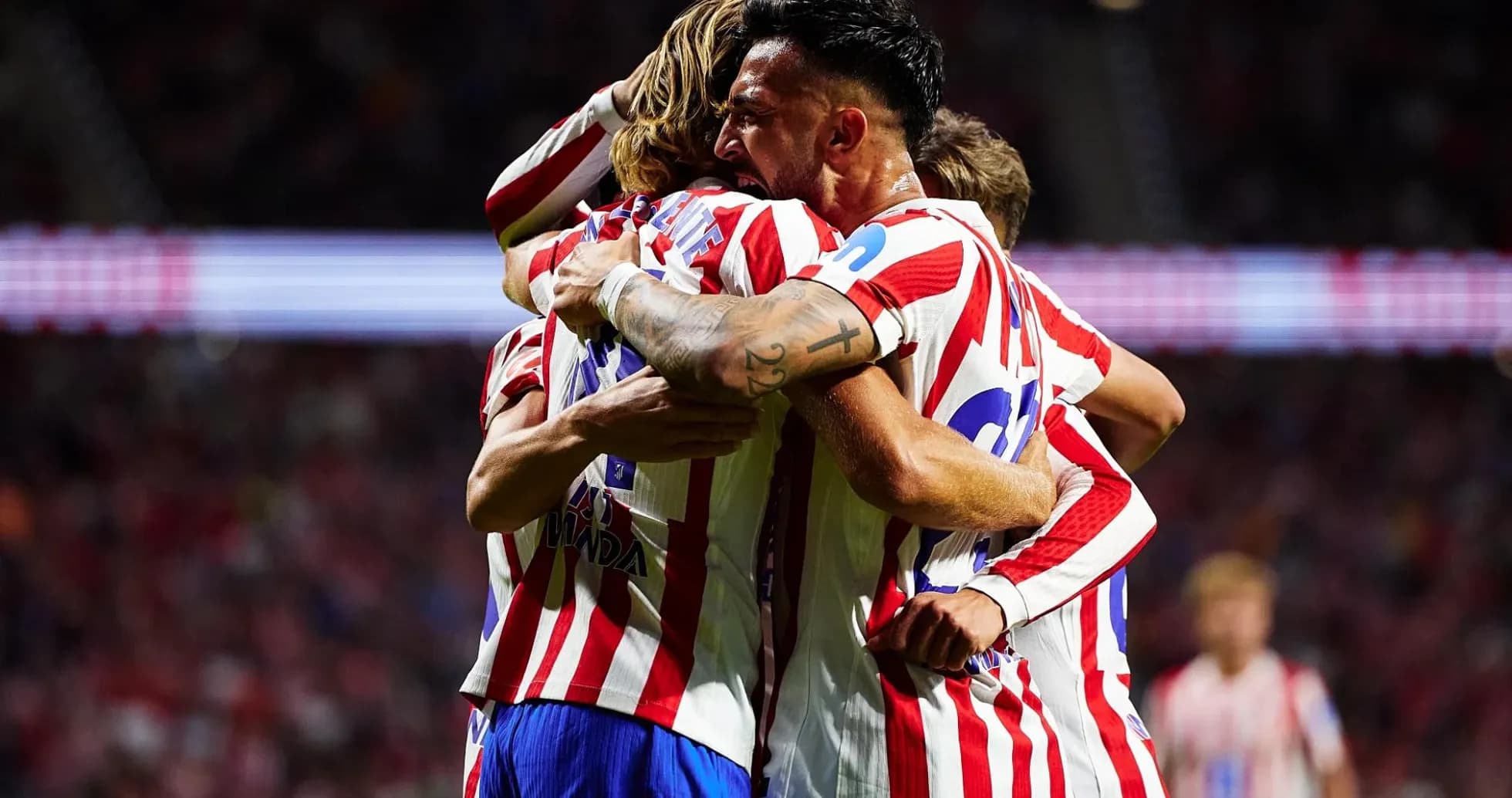 Atletico Madrid players celebrating a goal Atletico Madrid players celebrating a goal