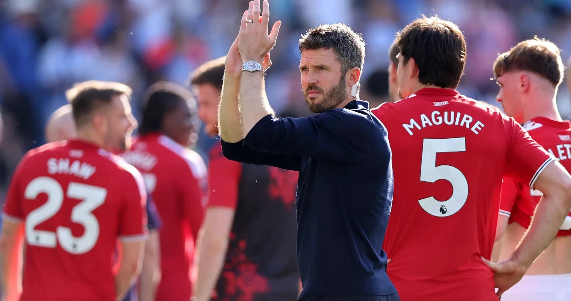 Manager and players applauding fans after match Manager and players applauding fans after match