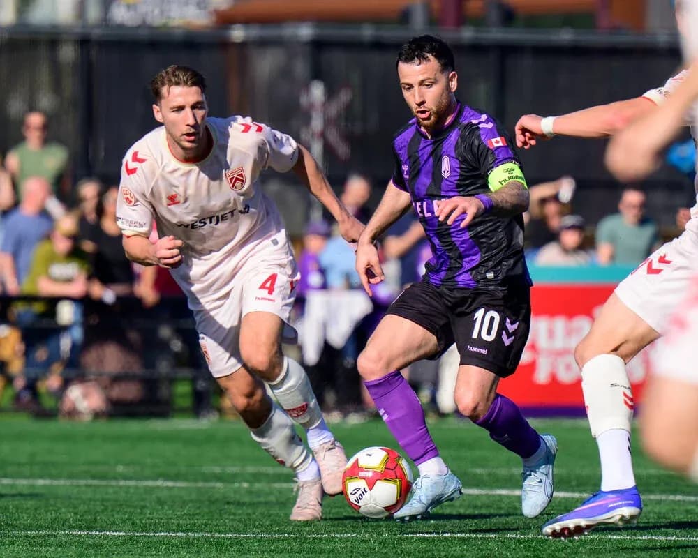 Cavalry FC and Pacific FC players in action Cavalry FC and Pacific FC players in action