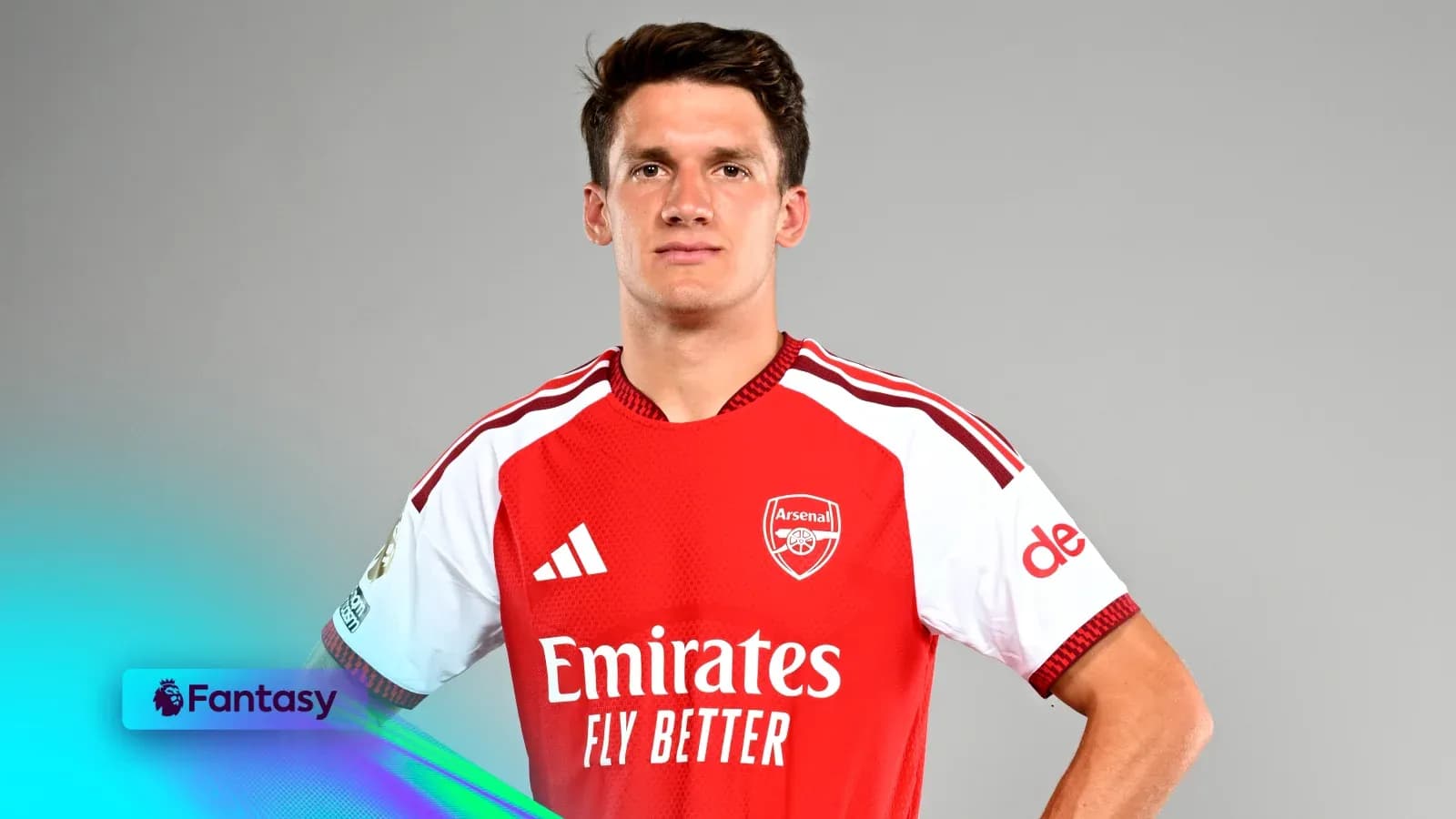 Player posing in Arsenal jersey with sponsor logos Player posing in Arsenal jersey with sponsor logos