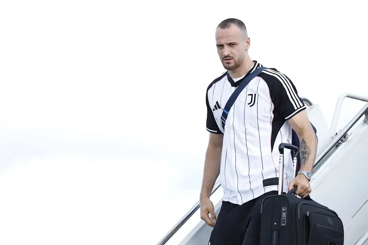 Player arriving with suitcase after flight Player arriving with suitcase after flight