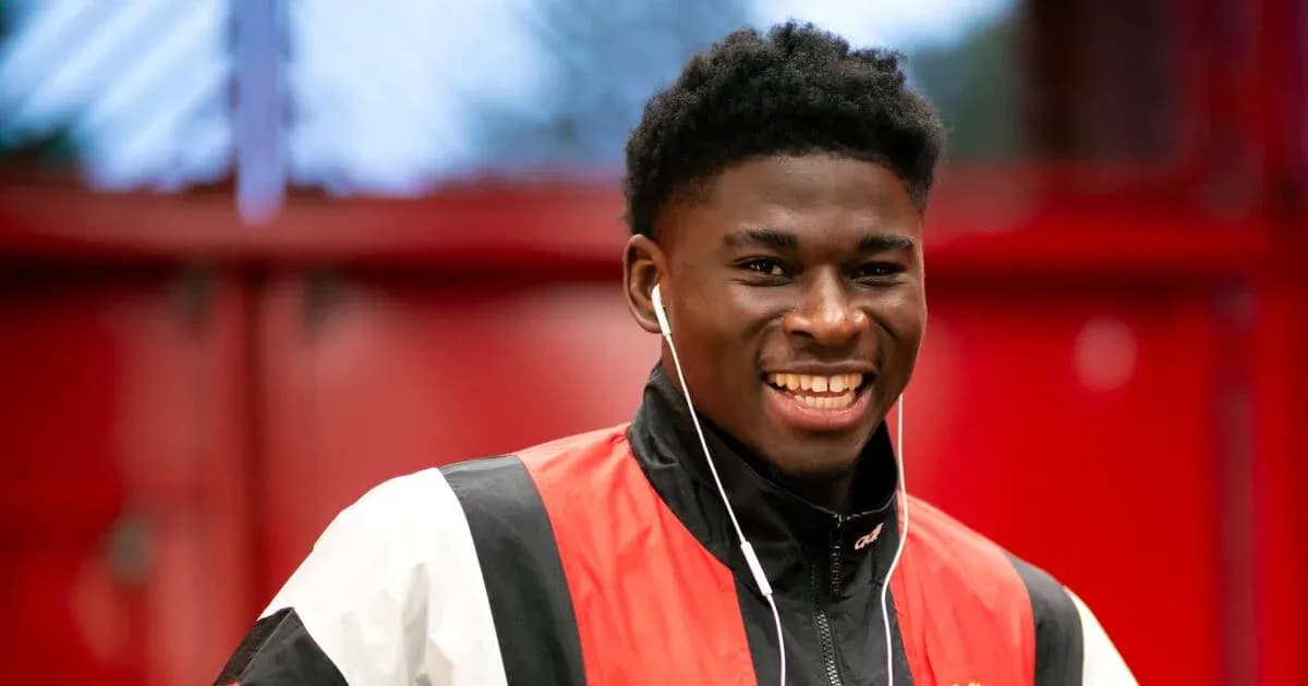 Smiling athlete wearing headphones in casual attire Smiling athlete wearing headphones in casual attire
