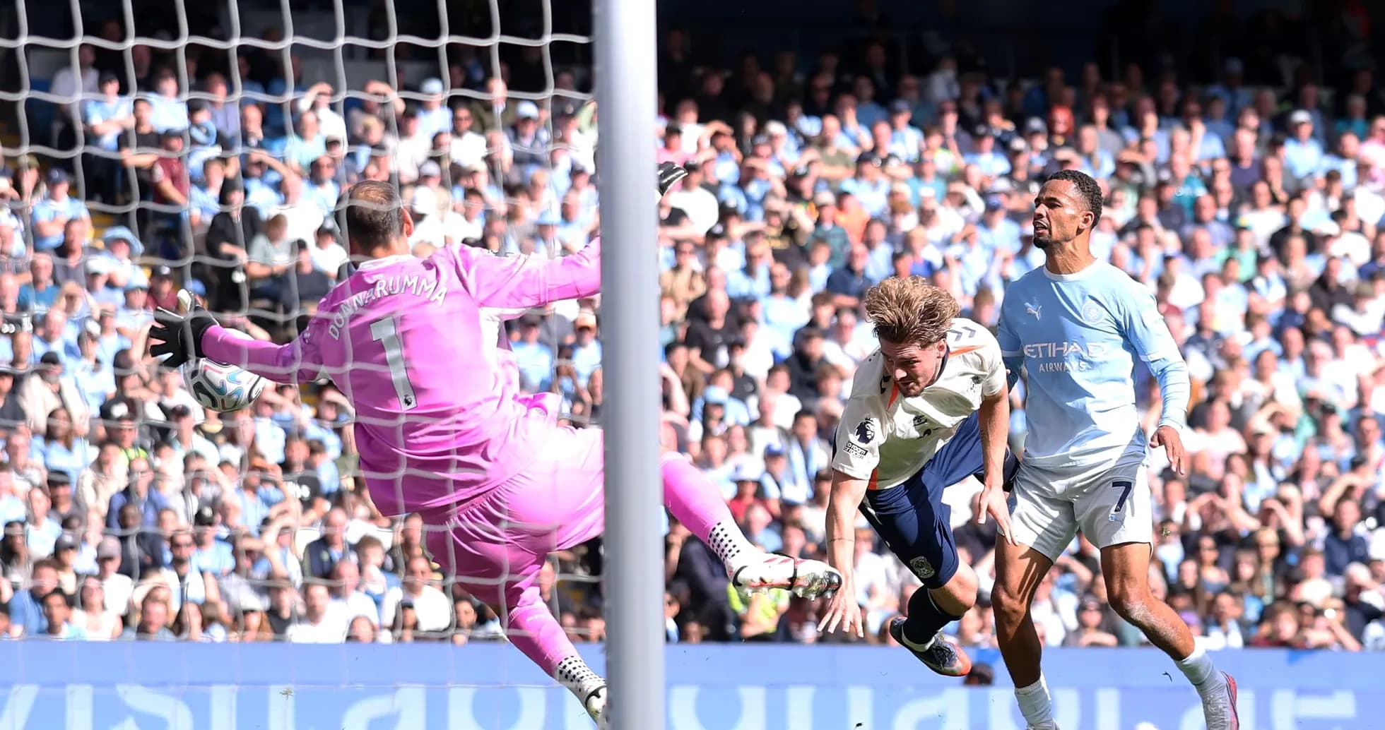 Goalkeeper saving a shot during a football match Goalkeeper saving a shot during a football match