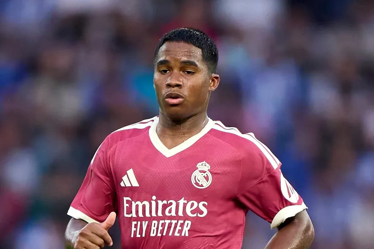 Player wearing pink Real Madrid jersey on field Player wearing pink Real Madrid jersey on field