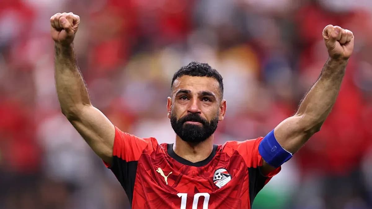 Player celebrating with raised fists after match Player celebrating with raised fists after match