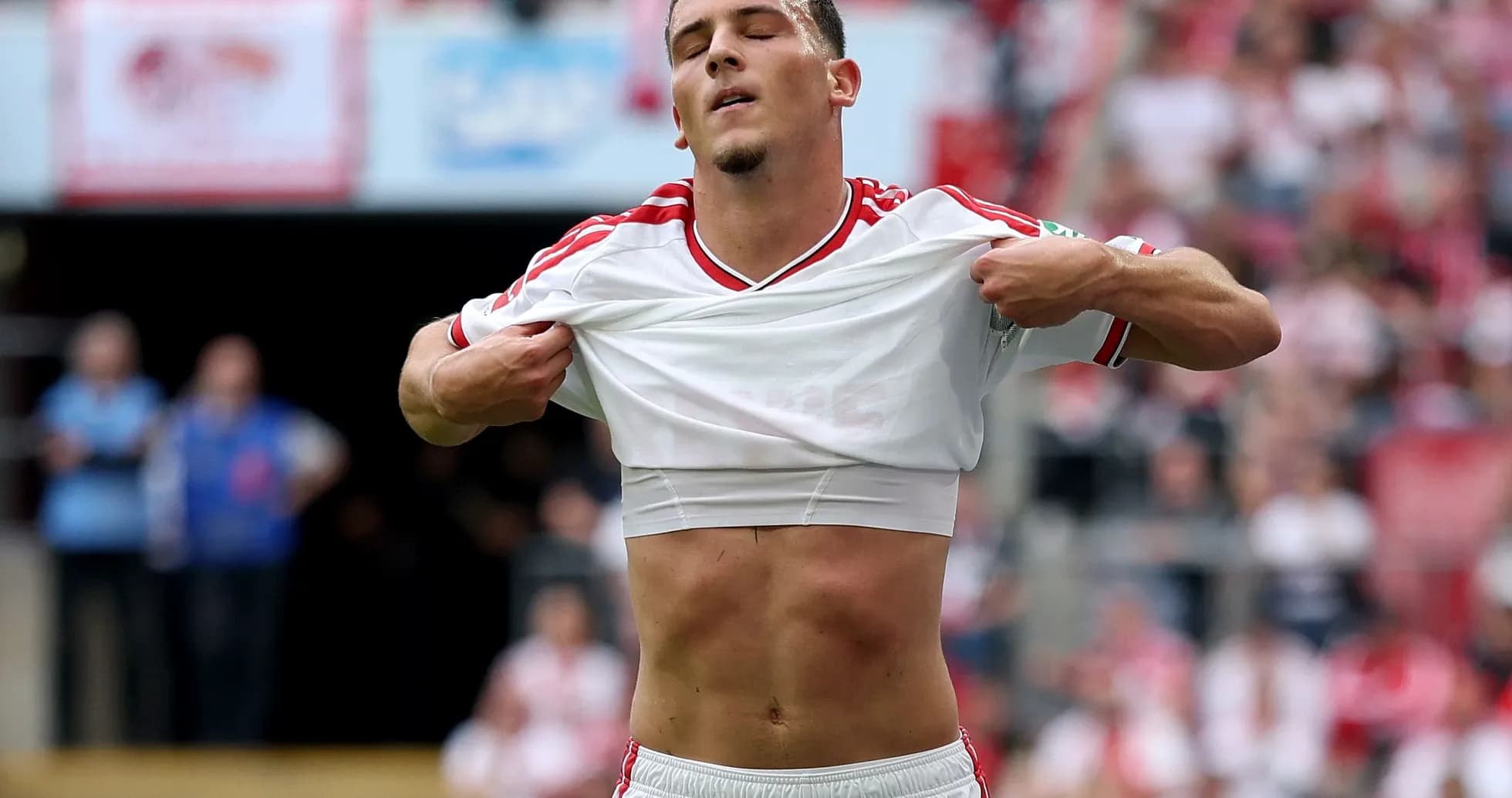Player removing shirt on the field during match Player removing shirt on the field during match