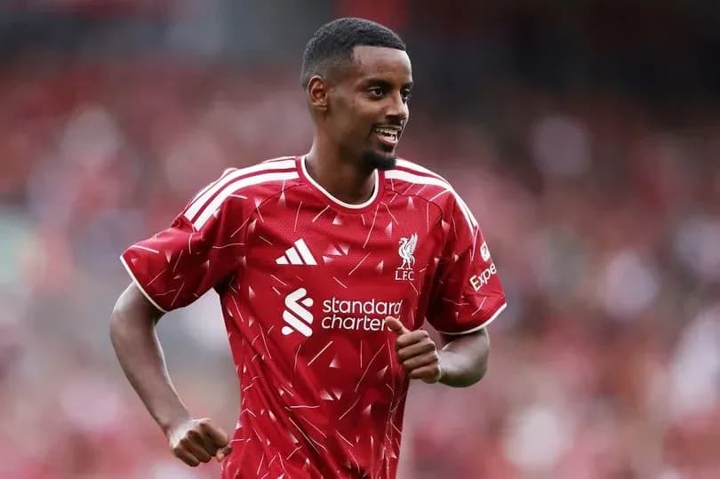 Player celebrating during match wearing Liverpool kit Player celebrating during match wearing Liverpool kit