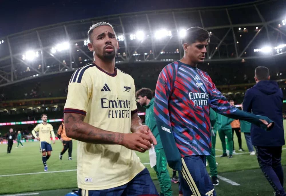 Arsenal players walking off the pitch after match Arsenal players walking off the pitch after match
